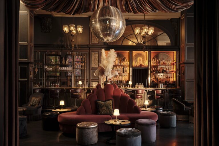 Fitz's Bar, with velvet banquettes, feathered lamps and a large mirrorball over the room, Kimpton Fitzroy London
