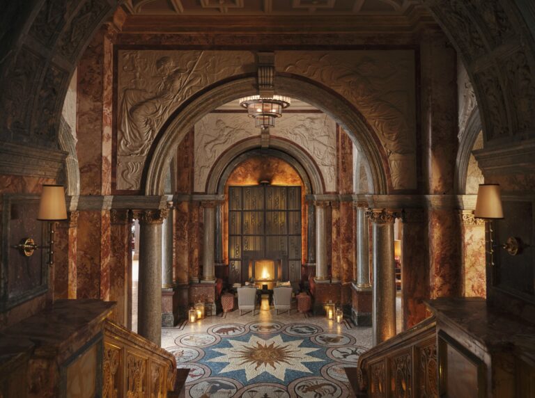 The lobby seen from the marble staircase, with carved arches and the mosaic floor below, Kimpton Fitzroy London