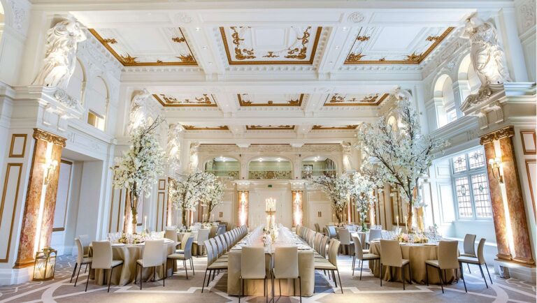 The full Ballroom laid for a wedding breakfast, mixing long and round tables beneath the coffered ceiling, Kimpton Fitzroy London