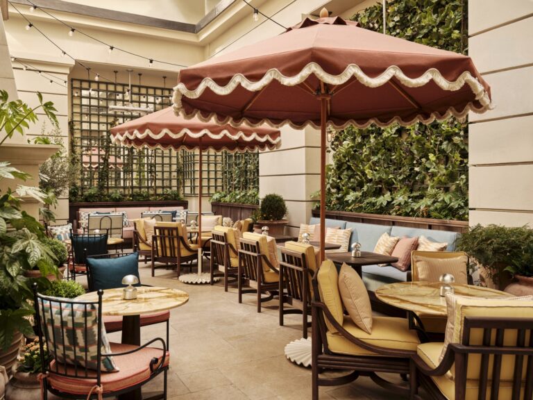 The Terrace courtyard with scalloped parasols, a living wall and marble-topped tables, Kimpton Fitzroy London