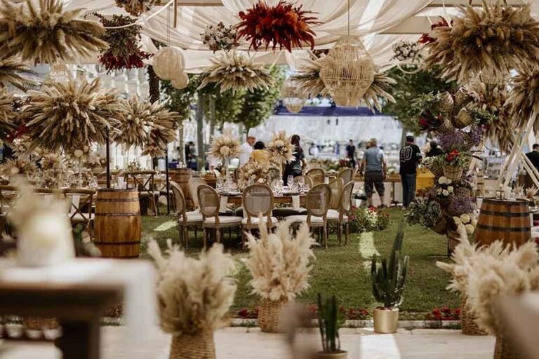 A marquee dressed with dried grasses and flowers, KM Events