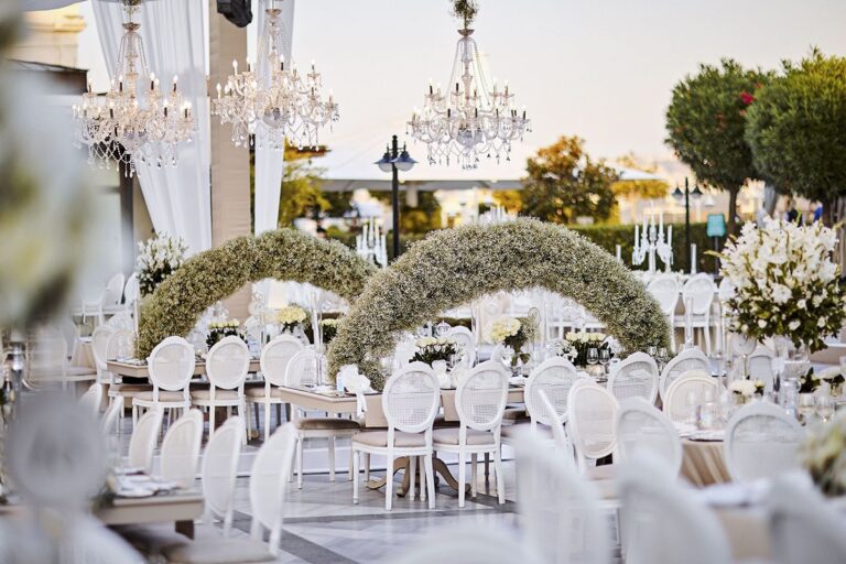 A reception with arches of white flowers, KM Events