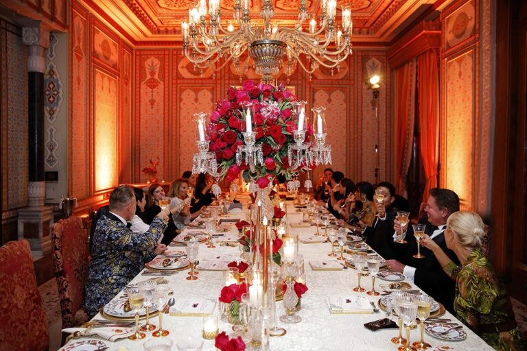 A long candlelit dining table in an ornate room, KM Events