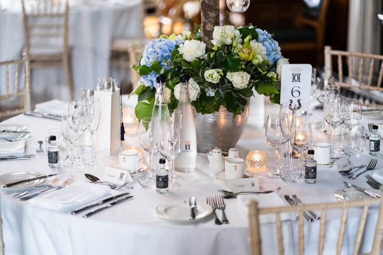 Round tables with flowers and glassware, Knowsley Hall