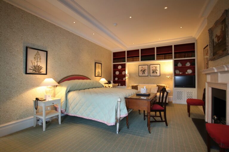 The Liverpool bedroom with a superking bed and fireplace, Knowsley Hall