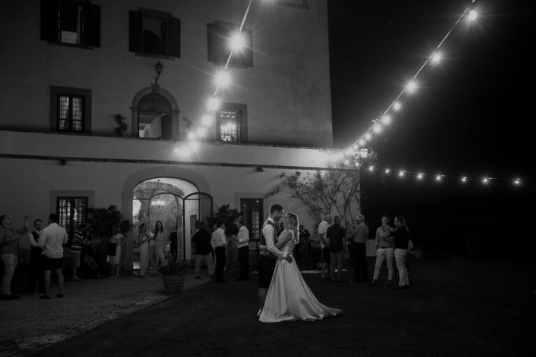 Dancing under string lights after dark, Tuscany, La Bottega del Sogno