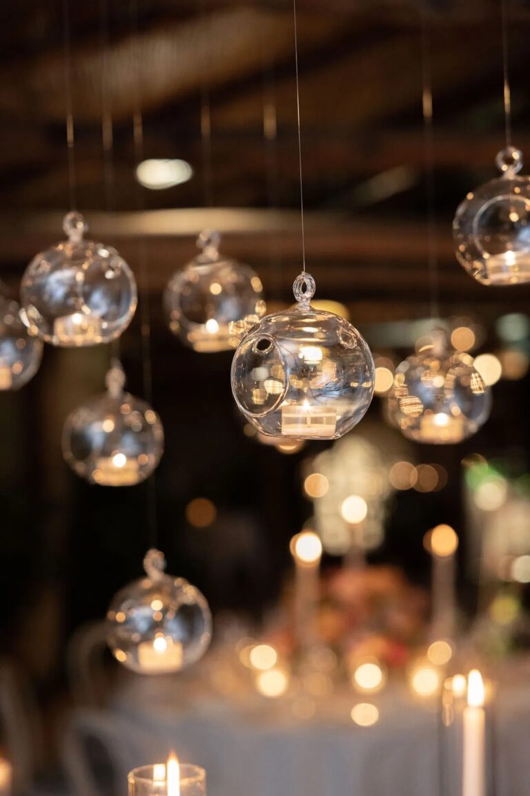 Glass globes holding tealights hung above the reception tables, Hotel Santa Caterina, Amalfi, La Calla Events