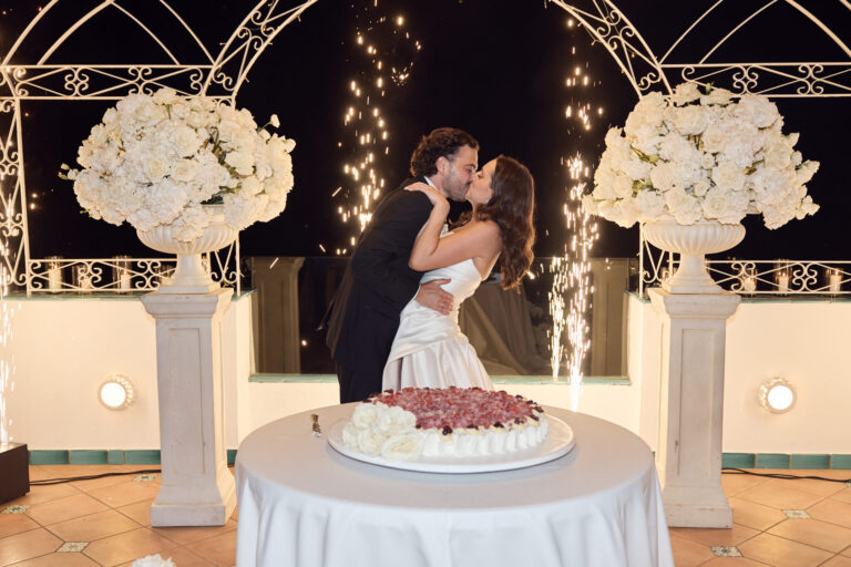 The couple at the cake between sparkler fountains under a white iron gazebo, Grand Hotel Tritone, Praiano, La Calla Events