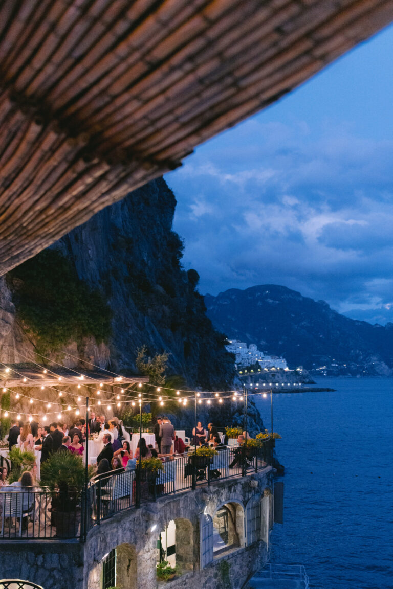 Dinner on a terrace beneath the cliff at blue hour, Hotel Santa Caterina, Amalfi, La Calla Events