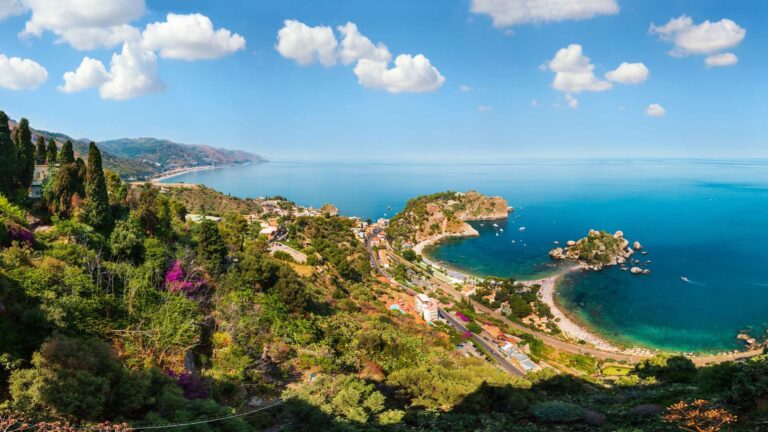The panorama over Taormina and the Isola Bella bay from the hillside above, La Plage Resort
