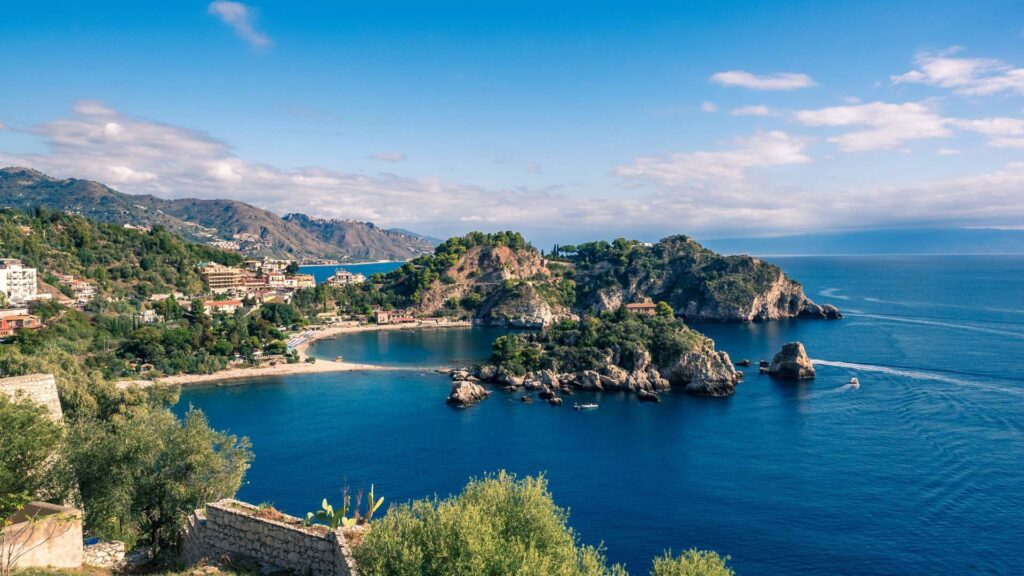 On the sand below Taormina