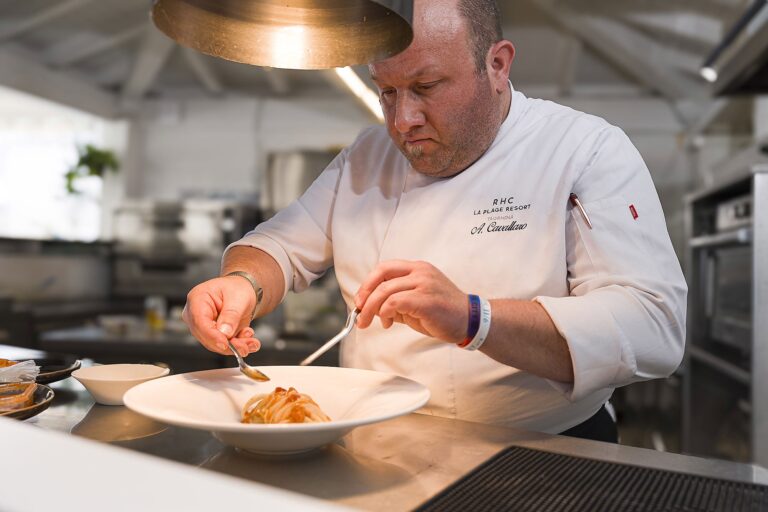 The chef plating in the Idda kitchen, La Plage Resort