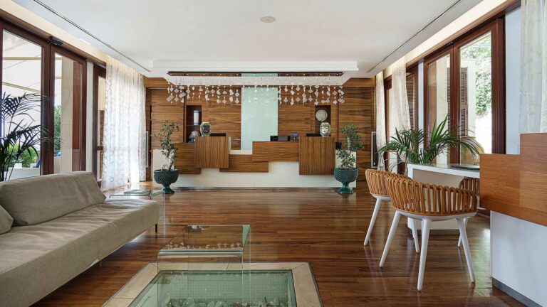 The resort lobby, warm wood and soft light, La Plage Resort