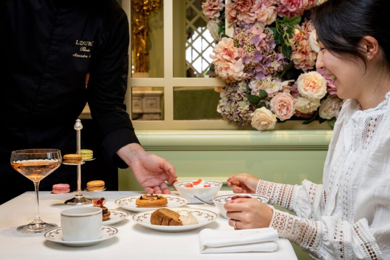 Afternoon tea served in a room dressed with hydrangeas and roses, Ladurée