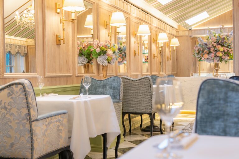 Private dining room with floral centrepieces, Ladurée