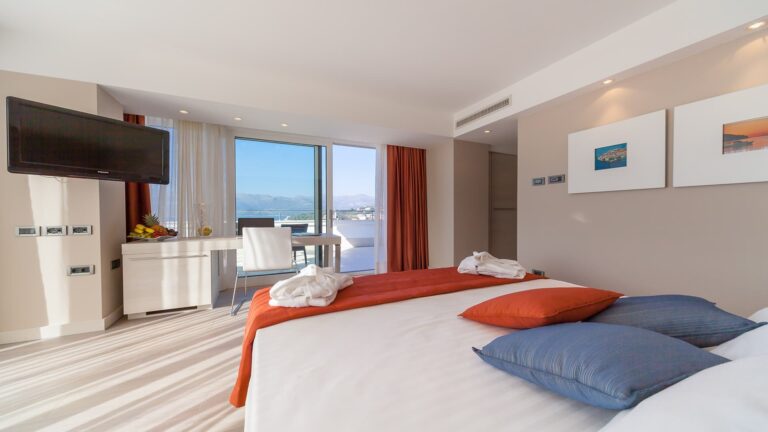 A Sky and Cloud suite, floor-to-ceiling glass opening onto the sea and a private terrace, Lafodia Sea Resort