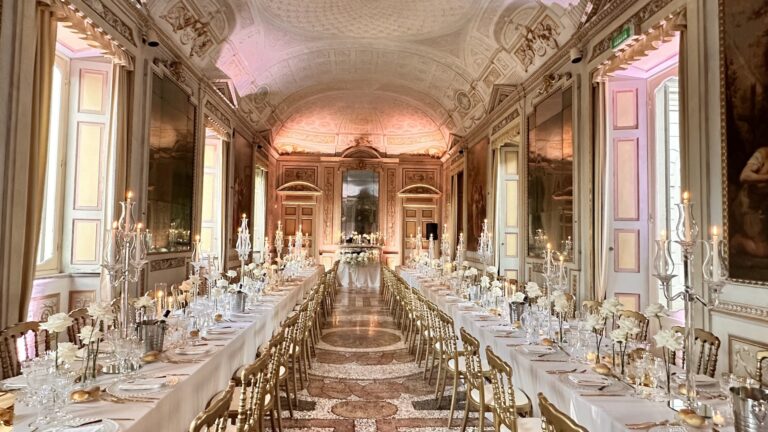 A frescoed and gilded hall laid with two long tables, candelabra and chandeliers, in a villa on Lake Maggiore, Lake Maggiore & Tuscany Weddings