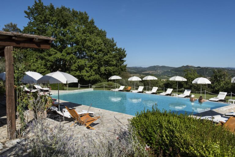 The panoramic infinity saltwater pool with Tiber valley views, Le Torri di Bagnara Castles