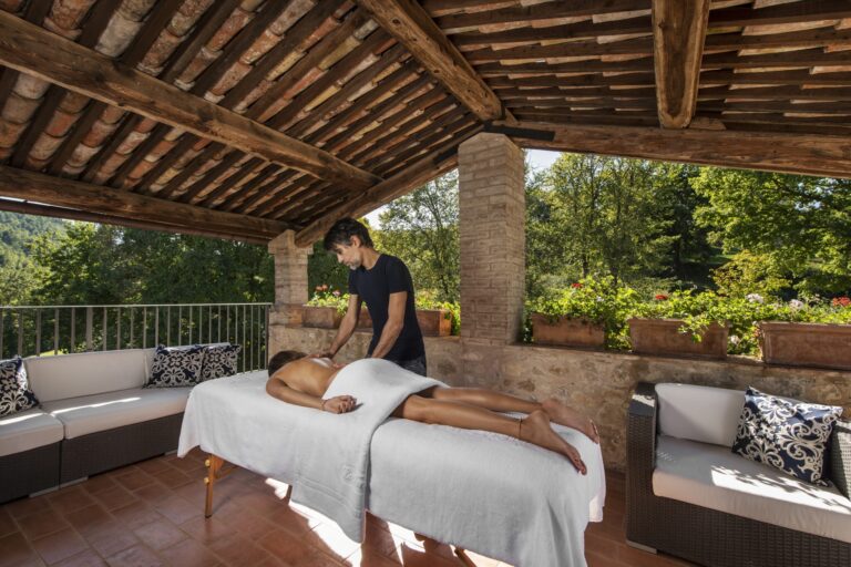 Poolside massage on the castle terrace, Le Torri di Bagnara Castles