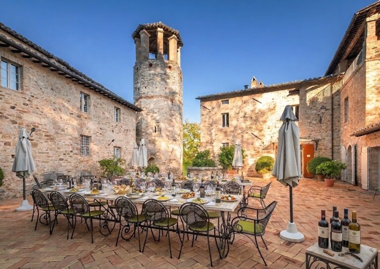 The courtyard set for dinner with Umbrian produce, Le Torri di Bagnara Castles