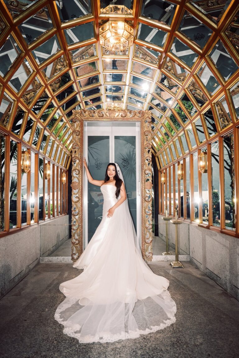 The bride alone in the gilded glass gallery at Villa del Balbianello, Leo Eventi