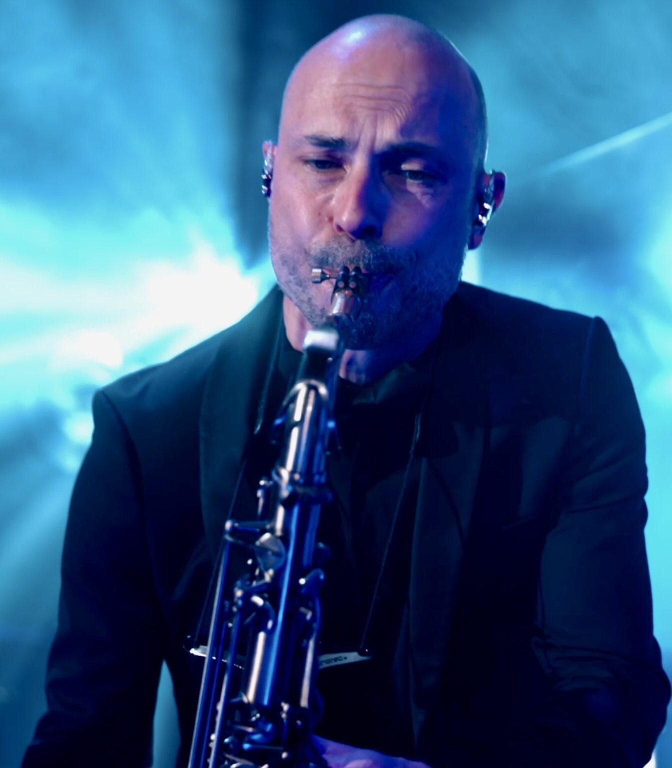 A saxophonist playing during a DJ live set