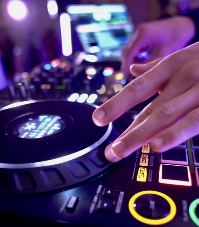 Close-up of hands on DJ decks, Les Cigales