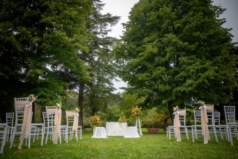Ceremony chairs and a welcome table on the lawn of a Piedmont estate, Letizia T. Events
