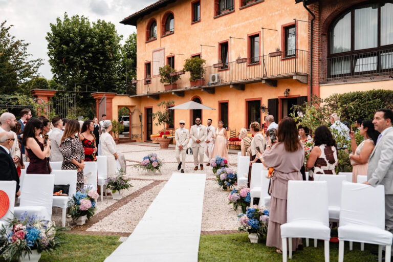 White aisle runner through a farmhouse courtyard set for a ceremony, Letizia T. Events