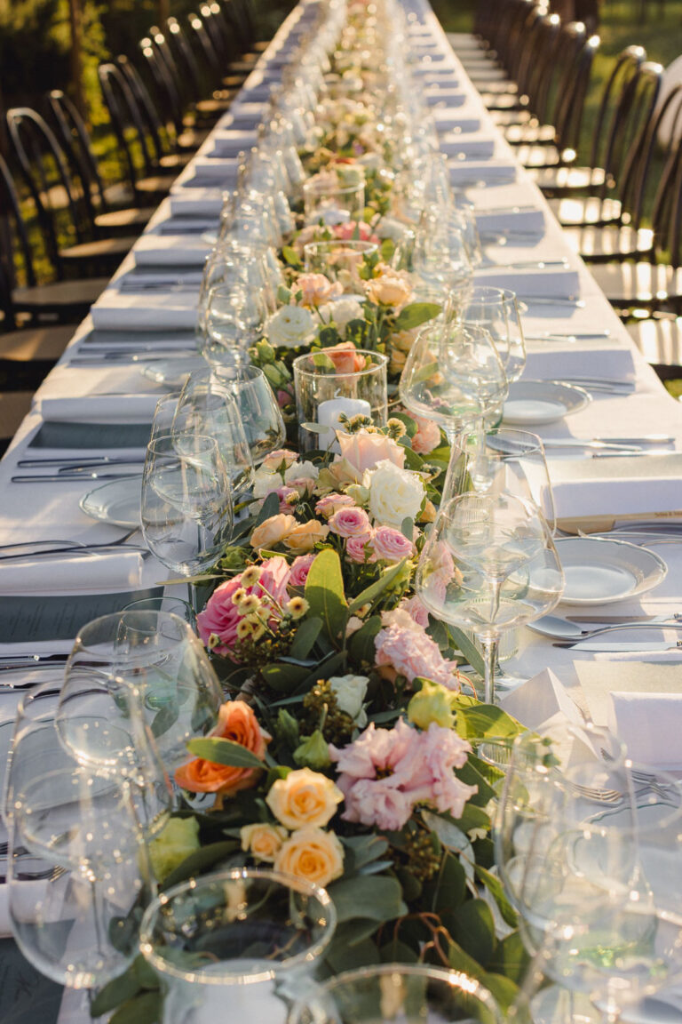 Long banquet table with a garland of roses and wild flowers, Letizia T. Events