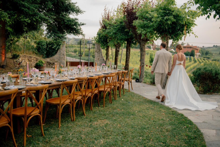 Long wooden-chaired table beside a path lined with plane trees at a Piedmont estate, Letizia T. Events