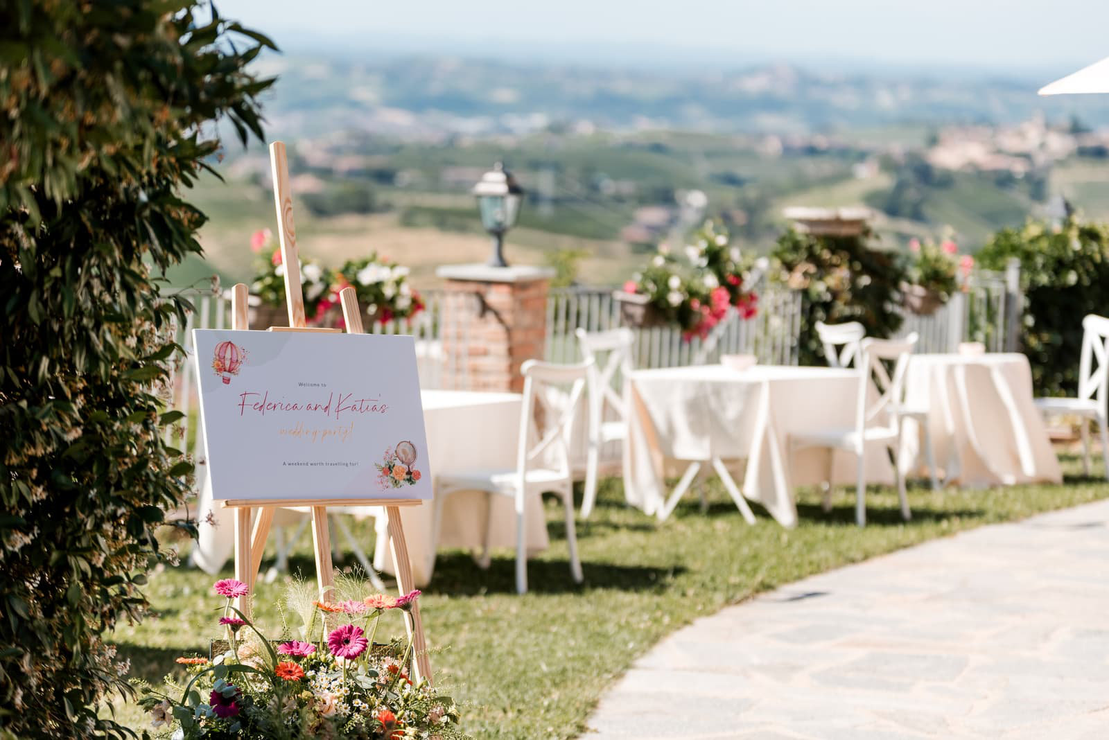 Welcome sign and reception tables on a garden terrace above the Piedmont hills, Letizia T. Events