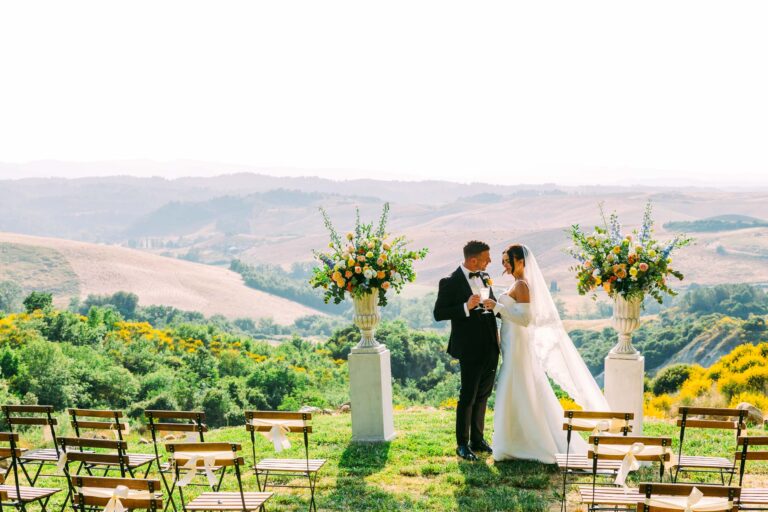 The hilltop ceremony at Country Relais Le Capanne, Volterra, with the Tuscan hills behind, Light & Dreams
