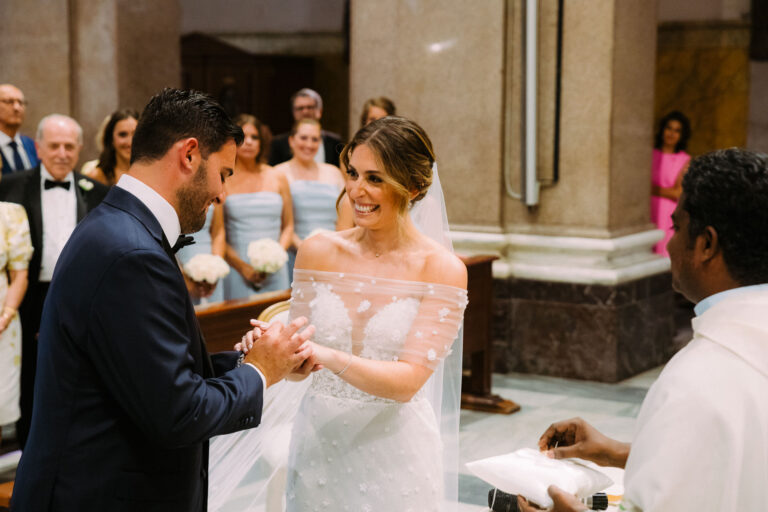 Tara and Antonio exchanging rings at their church ceremony in Rome, before the celebration at Villa Miani, Light & Dreams