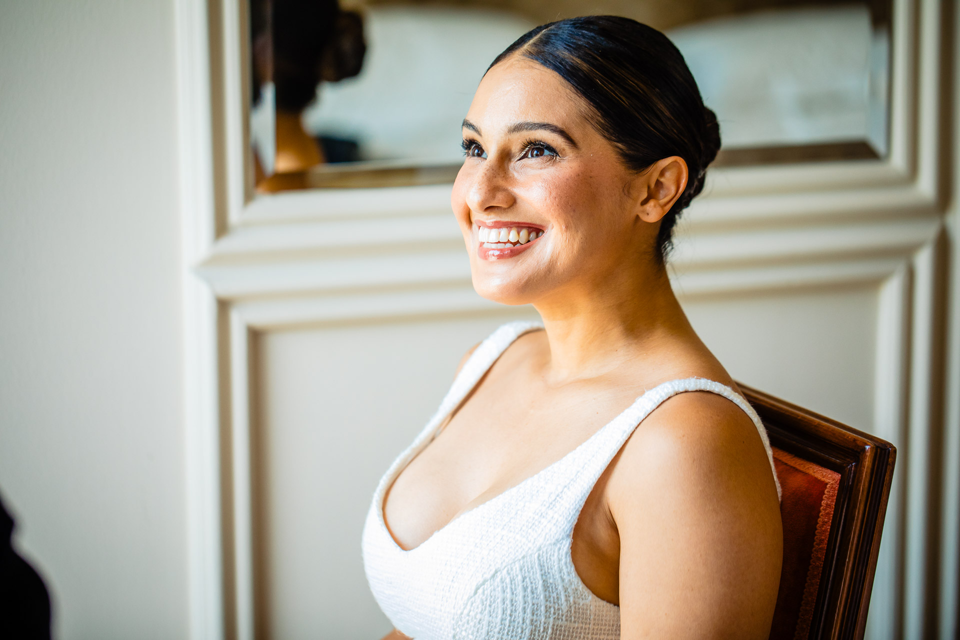 Victoria laughing as she gets ready on the morning of her Lake Como elopement, Light & Dreams