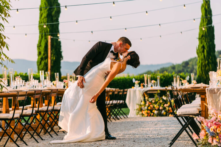 Jason dips Nikita for a kiss beside the dinner tables, Country Relais Le Capanne, Volterra, Light & Dreams
