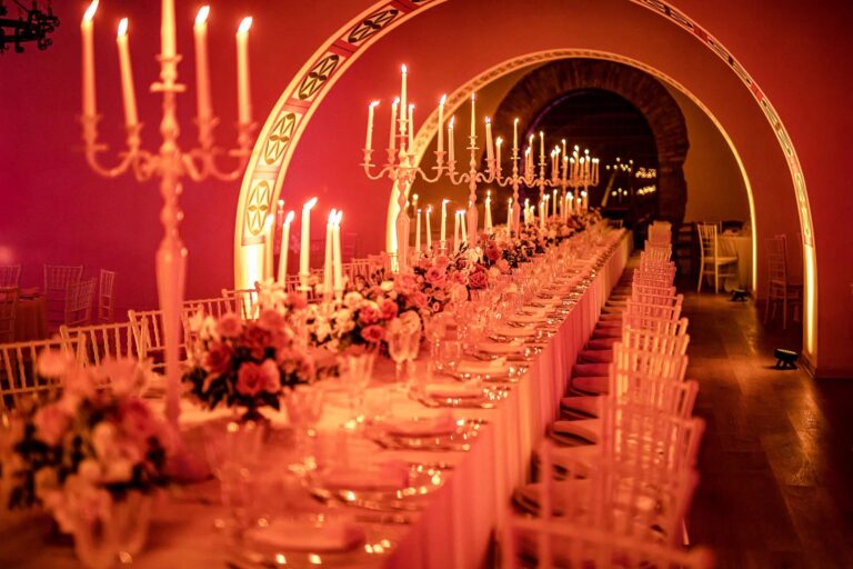 The candlelit dinner table under the brick vaults of Castello di Rosciano, Umbria, Light & Dreams