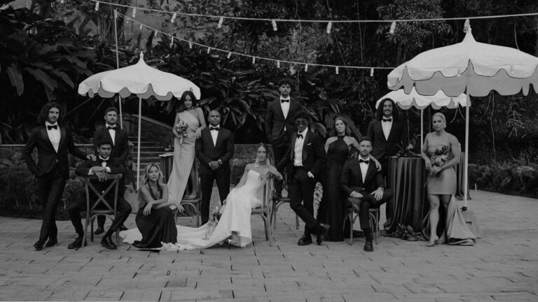Lauren and Danny with their wedding party under parasols, Kandy, Sri Lanka (film still, black and white), Lights and Magic