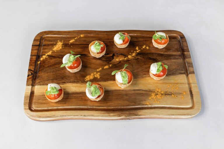 Tomato and mozzarella canapés on a wooden board, Lillibrooke Manor