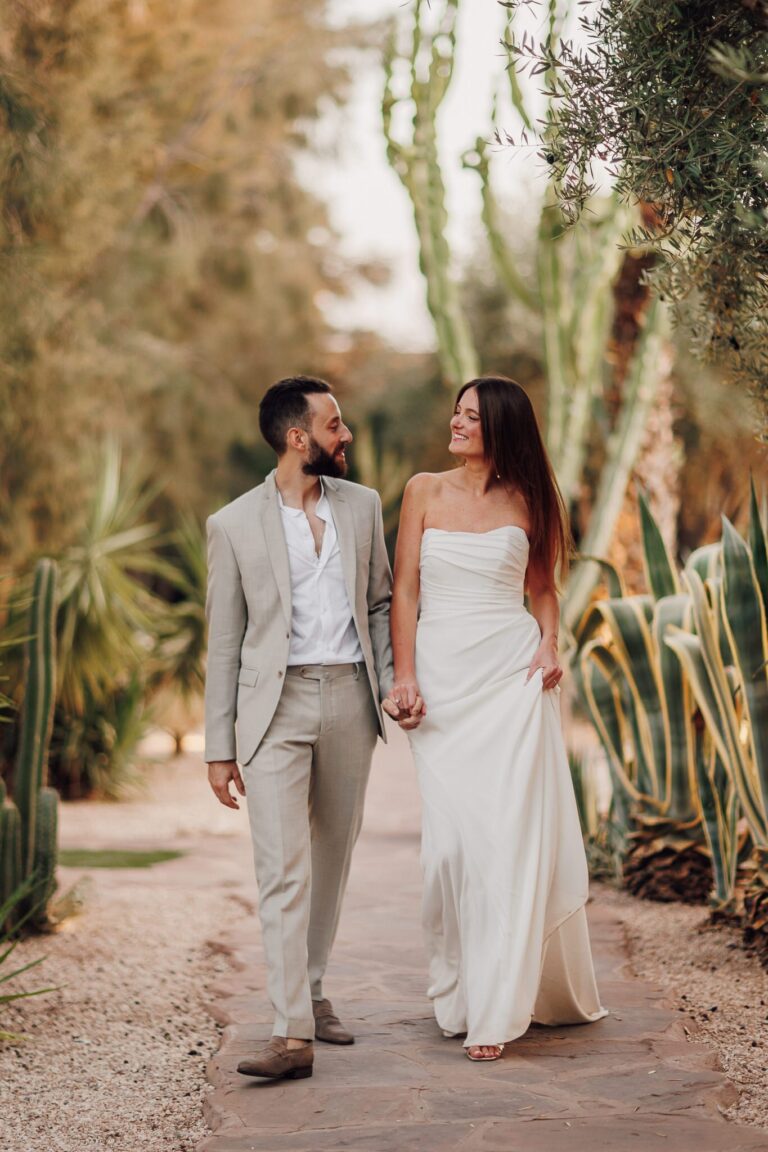 The couple walking through a cactus garden, Marrakech, Lina + Tom Photography