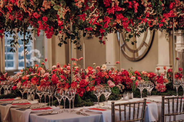 The wedding breakfast table under a canopy of florals, Howsham Hall, Lina + Tom Photography
