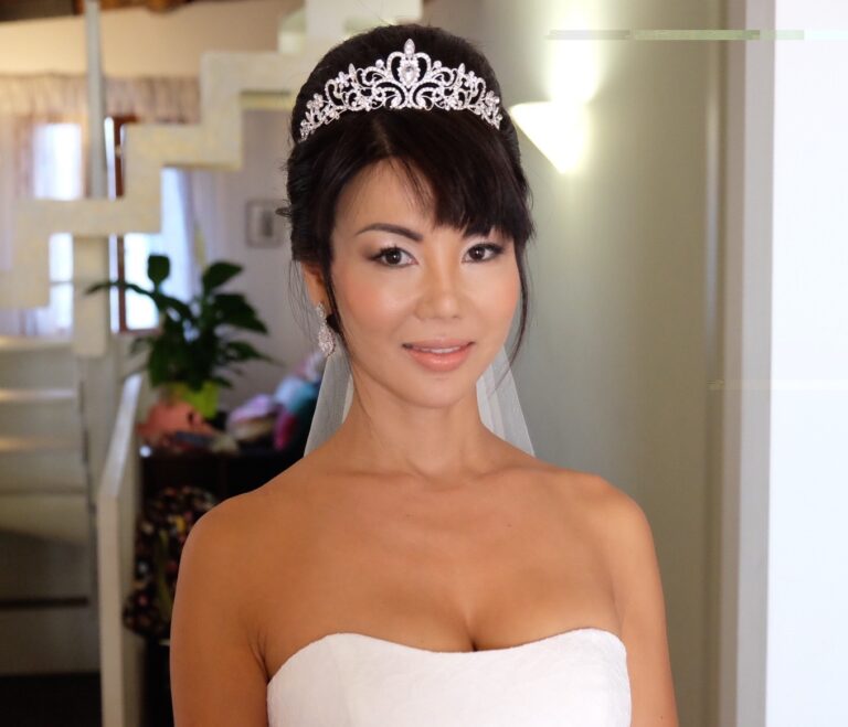 A bride wearing a tiara beneath an indoor archway, Lisa Semenzato
