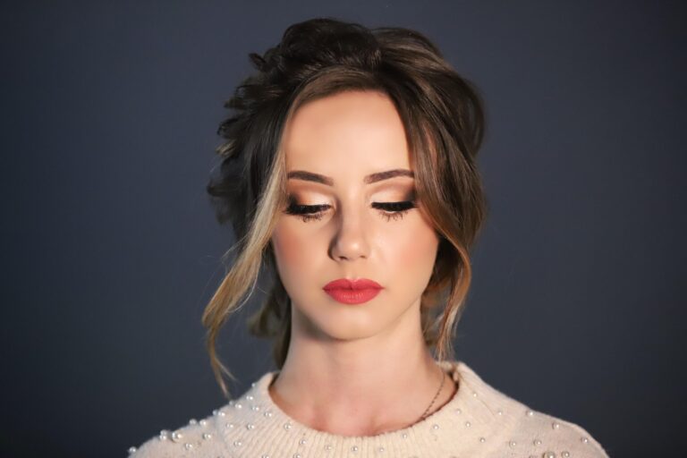 A bride against a dark blue backdrop, soft bridal glam, Lisa Semenzato