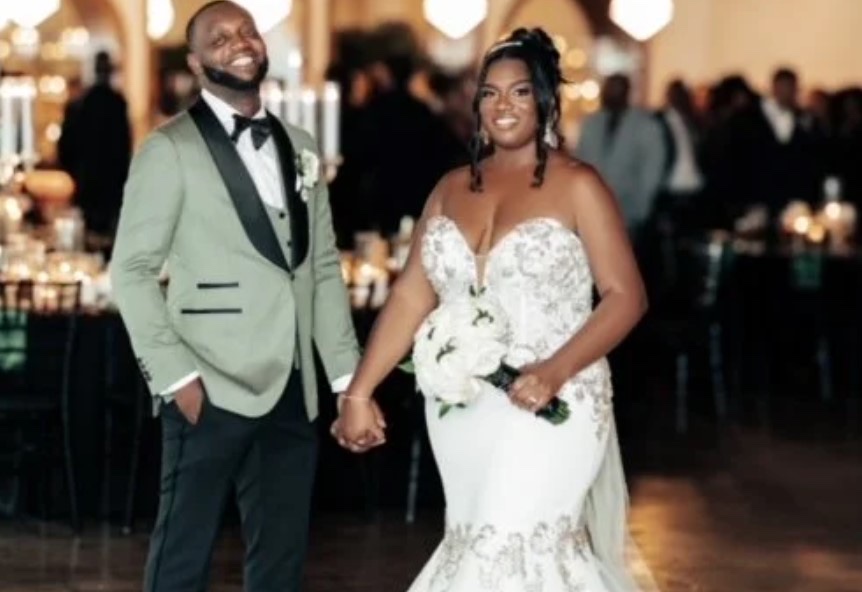 A bride and groom walking through their candlelit evening reception, Living Ceremonies