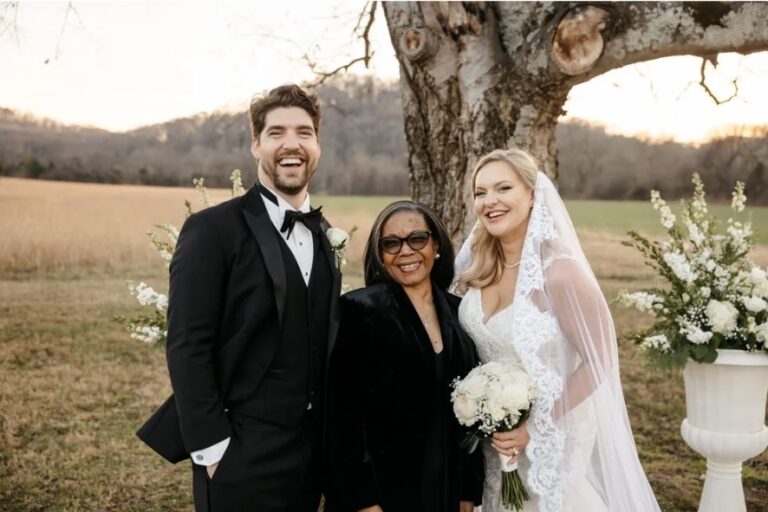 A couple and their officiant under an old tree in an open field at golden hour, Living Ceremonies