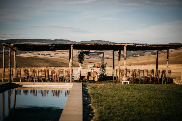 The pool and the pergola, with the hills behind, Locanda in Tuscany