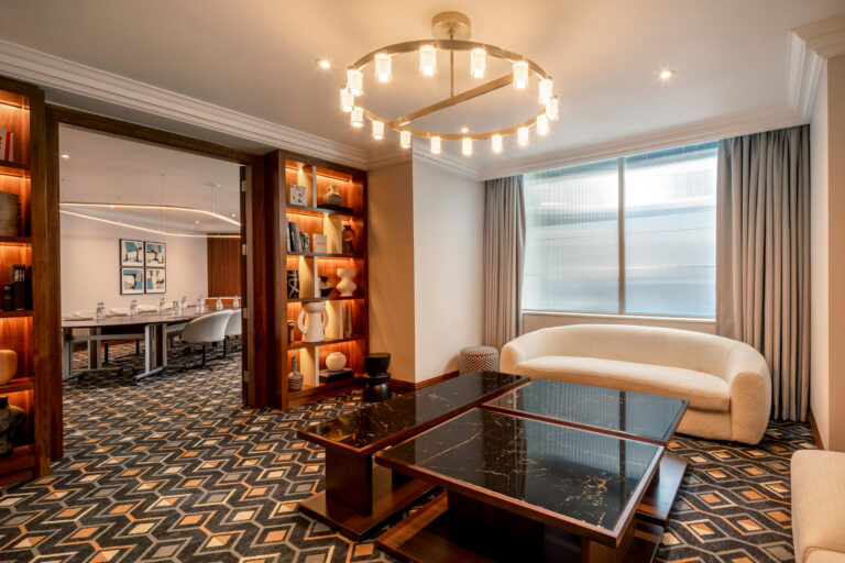 The Atholl Suite set with sofas for a private gathering, London Hilton on Park Lane