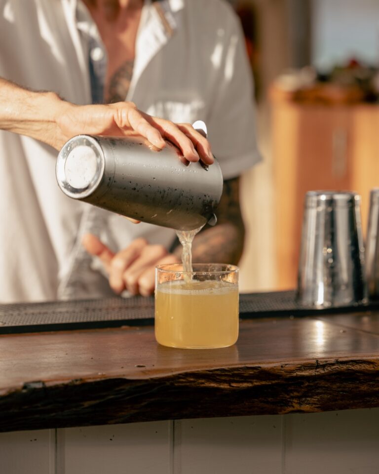 Cocktail being poured at the bar, Long Bay Beach Resort