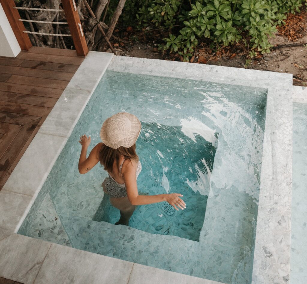 Hot tub on the deck of a beachside villa, Long Bay Beach Resort