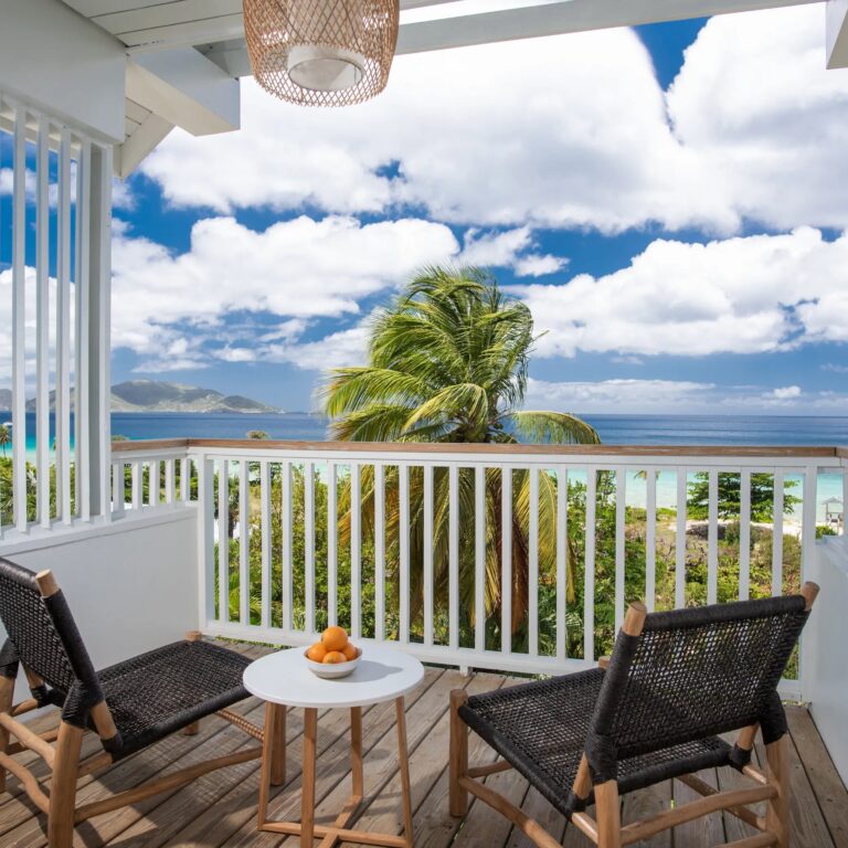 Hillside room terrace with an ocean view, Long Bay Beach Resort